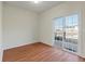 Living room with sliding door to patio and wood-look flooring at 113 Broad River Dr, Summerville, SC 29485