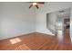 Bright living room features wood floors, a high ceiling, and a staircase leading to the upper level at 113 Broad River Dr, Summerville, SC 29485