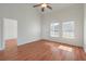 Bright living room features wood floors, a high ceiling, a fan, and lots of natural light at 113 Broad River Dr, Summerville, SC 29485