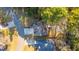 An aerial view of the property showing the driveway, neighboring homes, and surrounding trees at 1253 Lakefront Dr, Charleston, SC 29412