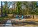 Secluded backyard with a gravel fire pit area and Adirondack chairs, perfect for relaxing at 1253 Lakefront Dr, Charleston, SC 29412