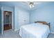 Charming bedroom with blue walls, carpet flooring, ceiling fan and a double door closet at 1253 Lakefront Dr, Charleston, SC 29412