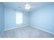 Bright bedroom with a window, neutral walls, ceiling fan, and carpet flooring at 1253 Lakefront Dr, Charleston, SC 29412