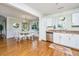 Open concept dining area with hardwood floors, a modern chandelier, and views of the kitchen at 1253 Lakefront Dr, Charleston, SC 29412