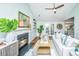 Bright living room featuring a fireplace, French doors, hardwood floors, and modern decor at 1253 Lakefront Dr, Charleston, SC 29412