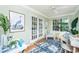 Inviting home office with french doors, stylish decor, and a comfortable seating area at 1253 Lakefront Dr, Charleston, SC 29412