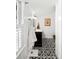 Charming bathroom featuring black vanity with marble countertop and decorative tile floor at 127 Oak St, McClellanville, SC 29458