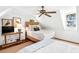 Bright bedroom features vaulted ceilings, two beds, and stylish furnishings with an abundance of natural light at 127 Oak St, McClellanville, SC 29458
