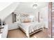 Bright bedroom features vaulted ceilings, a plush bed, stylish furnishings and an abundance of natural light at 127 Oak St, McClellanville, SC 29458