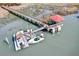 Waterfront home featuring a private dock with a gazebo and boat lift, ideal for boating at 127 Oak St, McClellanville, SC 29458
