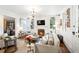 Charming living room with fireplace, neutral sofa, and decor at 127 Oak St, McClellanville, SC 29458
