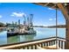 Relaxing outdoor lounge area with views of docked boats and waterfront scenery, perfect for enjoying the coastal atmosphere at 127 Oak St, McClellanville, SC 29458
