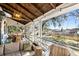 Inviting screened porch with comfortable seating and view of the waterfront at 127 Oak St, McClellanville, SC 29458
