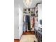 Organized walk-in closet with ample storage space and natural light for clothing, shoes, and accessories at 127 Oak St, McClellanville, SC 29458