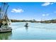 Beautiful water view showcasing the waterway, boats, and waterfront properties, all set under a clear blue sky at 127 Oak St, McClellanville, SC 29458