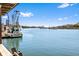Picturesque water view showcasing the wide waterway and boats, with charming waterfront houses on the horizon at 127 Oak St, McClellanville, SC 29458