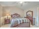 Bedroom featuring a ceiling fan, bedside tables with lamps, and a dresser with mirror at 128 Hornby Cir, Goose Creek, SC 29445