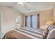 Bedroom showcasing a ceiling fan, bedside table, and an ensuite bathroom at 128 Hornby Cir, Goose Creek, SC 29445