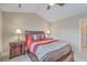 Comfortable bedroom boasts a ceiling fan, bedside lamps, and neutral color scheme at 128 Hornby Cir, Goose Creek, SC 29445
