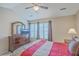 Bright bedroom featuring a dresser, large window, and comfortable bed at 128 Hornby Cir, Goose Creek, SC 29445