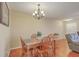 Dining room with a wood table, chandelier lighting, and hardwood floors at 128 Hornby Cir, Goose Creek, SC 29445