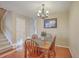 Bright dining area with a wooden table set, chandelier, and hardwood floors at 128 Hornby Cir, Goose Creek, SC 29445