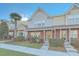 Charming townhomes featuring brick and siding exteriors, complemented by a well-manicured front yard at 128 Hornby Cir, Goose Creek, SC 29445