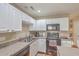 Practical kitchen design with white cabinets, a kitchen island, and essential appliances at 128 Hornby Cir, Goose Creek, SC 29445