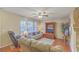 Cozy living room features hardwood floors, a ceiling fan, and access to the staircase at 128 Hornby Cir, Goose Creek, SC 29445