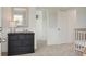Neutral Bedroom boasting a black dresser with a mirror and an open closet, providing ample storage space at 133 Threaded Fern St, Summerville, SC 29485