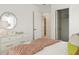 Comfortable bedroom showcasing soft tones, a decorative mirror, and abundant light for a welcoming space at 133 Threaded Fern St, Summerville, SC 29485