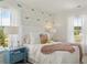 Inviting bedroom with soft colors, a cozy bed, and natural light creates a peaceful and charming ambiance at 133 Threaded Fern St, Summerville, SC 29485