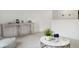 Cozy loft area with comfortable seating, a decorative table, and a light and airy ambiance at 133 Threaded Fern St, Summerville, SC 29485