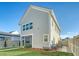 Charming two-story home with landscaped yard, a screened porch, and a well-manicured lawn at 142 Midtown Ave, Summerville, SC 29486