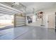 Spacious two-car garage with epoxy flooring and high ceilings and natural light at 142 Midtown Ave, Summerville, SC 29486