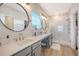 The main bathroom features double sinks, a vanity area, and a glass-enclosed shower at 142 Midtown Ave, Summerville, SC 29486