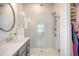 The main bathroom has a glass shower, a vanity with a sink, and a closet at 142 Midtown Ave, Summerville, SC 29486