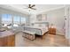 Serene main bedroom offers natural light, ceiling fan, hardwood floors, and ample space at 142 Midtown Ave, Summerville, SC 29486