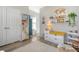 Bright playroom featuring decorative maps, furniture and decor, natural light and wood-look flooring at 142 Midtown Ave, Summerville, SC 29486
