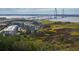 Stunning aerial view of a waterfront condominium complex with views of the Ravenel Bridge at 155 Wingo Way # 421, Mount Pleasant, SC 29464