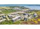 Aerial view of a coastal condominium community near a highway, golf course, and the ocean at 155 Wingo Way # 421, Mount Pleasant, SC 29464