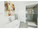 Freestanding tub in stylish bathroom featuring a glass shower with stone tile at 155 Wingo Way # 421, Mount Pleasant, SC 29464