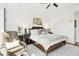 Comfortable bedroom featuring a sitting area near the bright window and modern furniture at 155 Wingo Way # 421, Mount Pleasant, SC 29464
