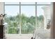 Palm tree and neighborhood views from a bedroom window at 155 Wingo Way # 421, Mount Pleasant, SC 29464