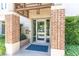 Building entrance featuring brick columns and a glass door at 155 Wingo Way # 421, Mount Pleasant, SC 29464