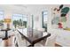 Elegant dining room featuring hardwood floors, ample natural light, and modern artwork at 155 Wingo Way # 421, Mount Pleasant, SC 29464