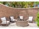 A cozy outdoor fire pit with comfortable seating surrounded by a beautiful brick privacy wall at 155 Wingo Way # 421, Mount Pleasant, SC 29464