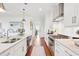 Spacious, brightly lit kitchen with stainless steel appliances and a sink island at 155 Wingo Way # 421, Mount Pleasant, SC 29464