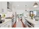 Bright, open kitchen featuring modern stainless steel appliances and an island with a sink at 155 Wingo Way # 421, Mount Pleasant, SC 29464