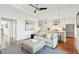 Open-concept living room flows to the modern kitchen with stainless steel appliances and eat-in bar at 155 Wingo Way # 421, Mount Pleasant, SC 29464